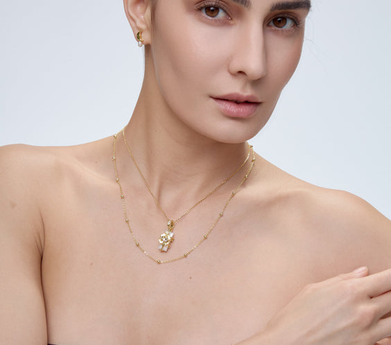 Ladybug Clover Charm pendant with crystal detail on model - FREQNC