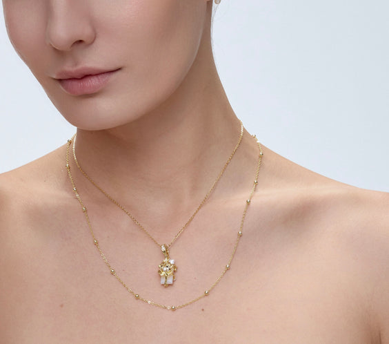 Spirit Animal Talisman pendant on model with layered styling - FREQNC