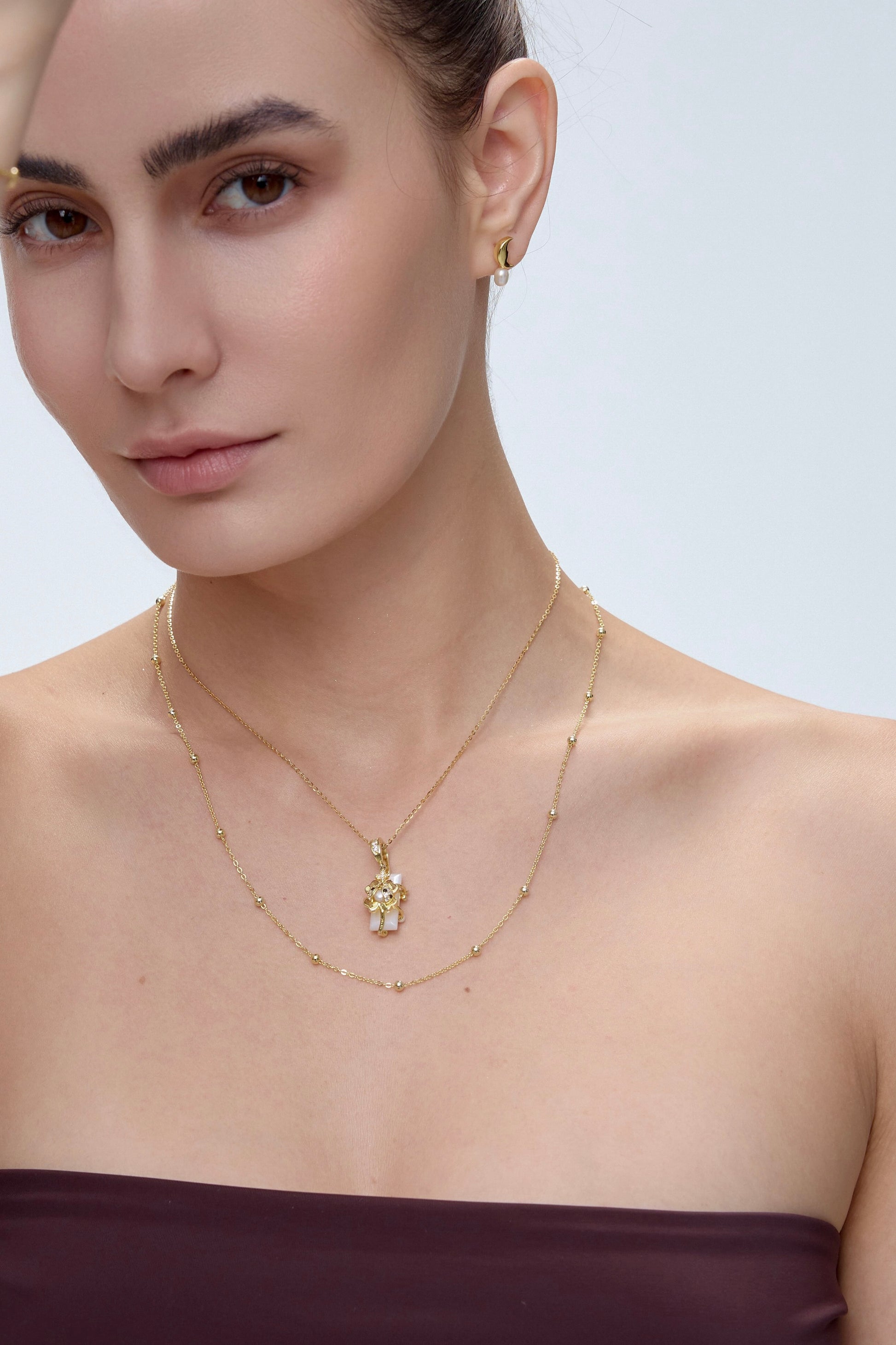 Spirit Animal Talisman pendant on model with layered styling - FREQNC