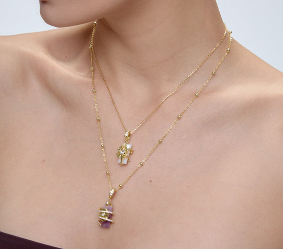 Serpent Charm layered styling with mother of pearl and lavender amethyst pendants - FREQNC spirit animal necklace
