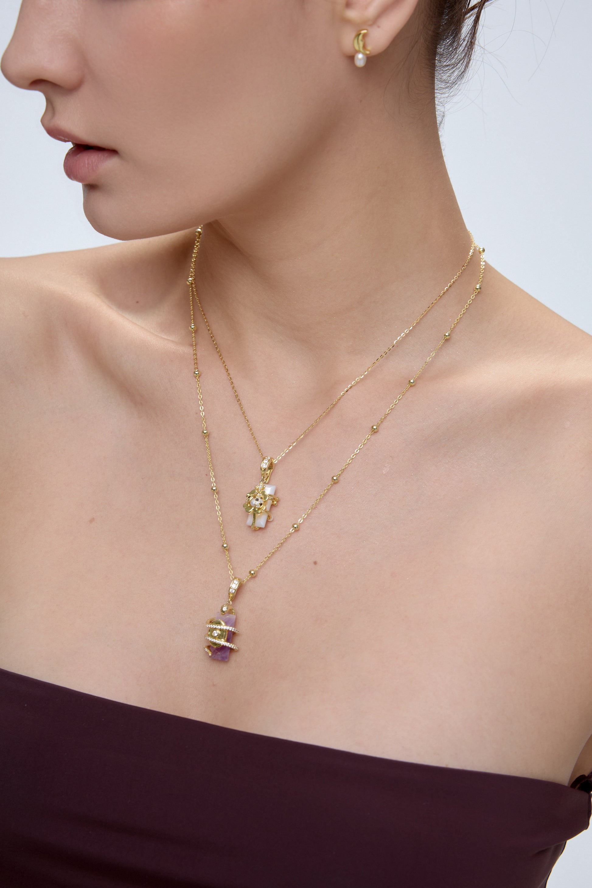 Serpent Charm layered styling with mother of pearl and lavender amethyst pendants - FREQNC spirit animal necklace