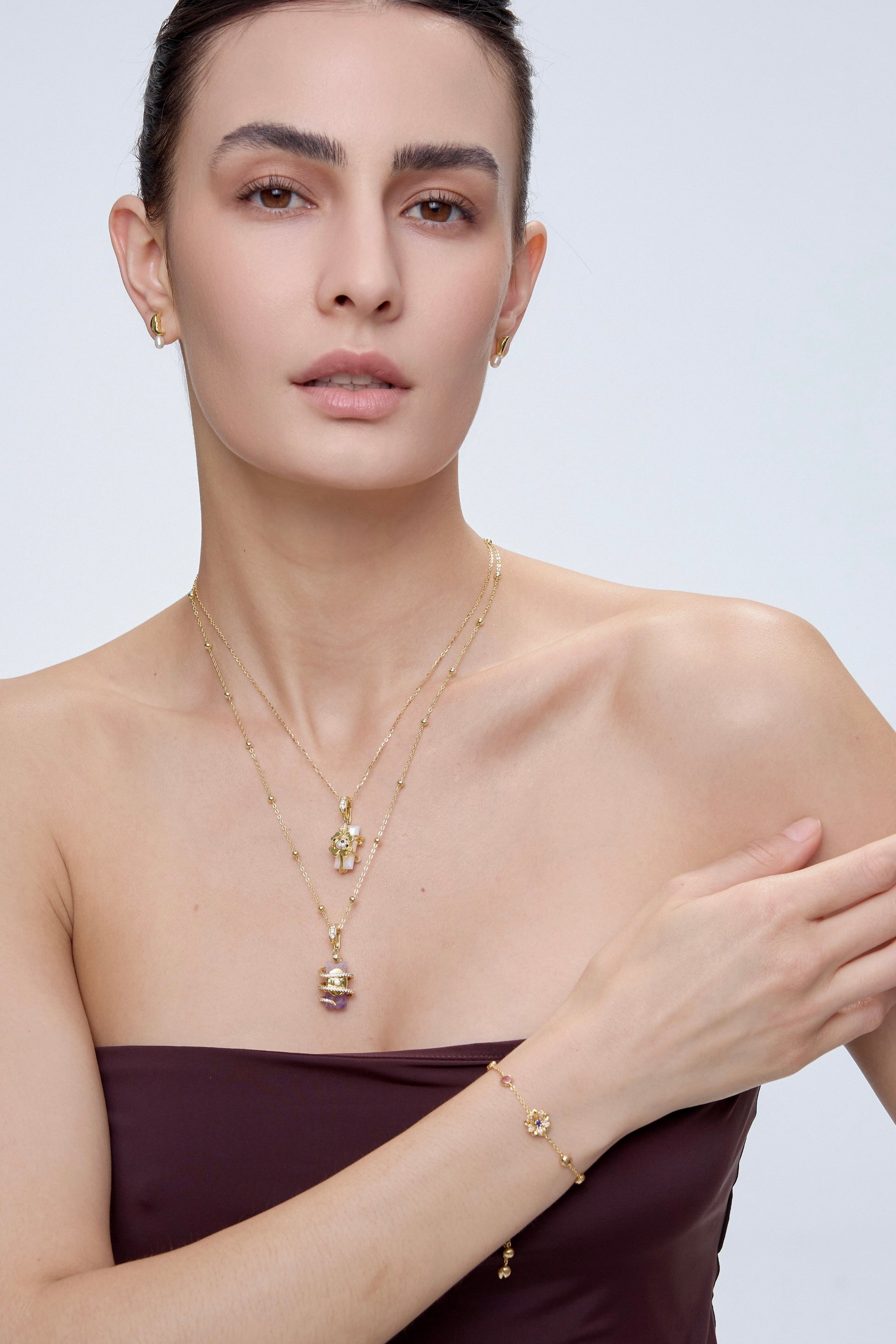 Ladybug Clover Charm styling with gold layered necklace - FREQNC