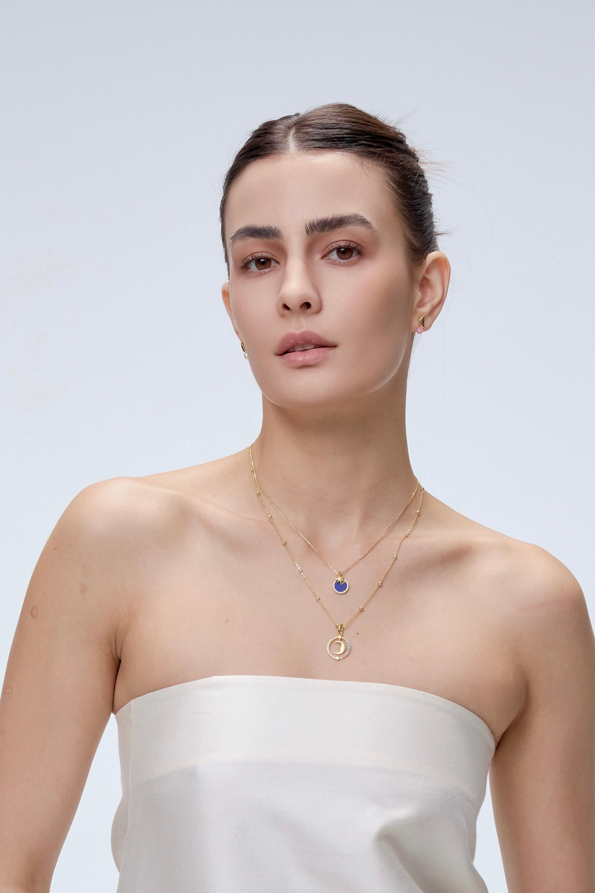 Moon Charm worn on model with gold chain necklace - FREQNC