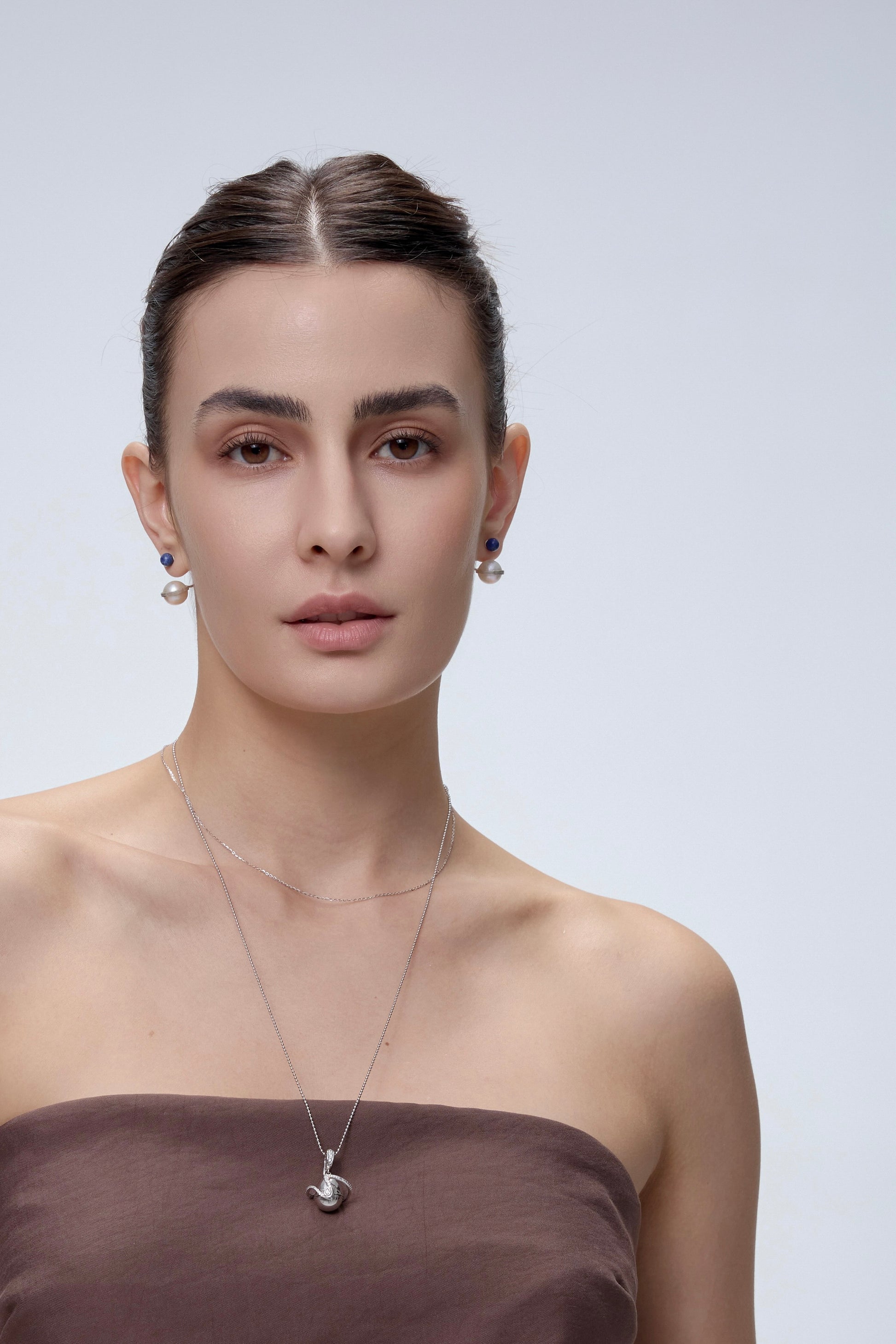 Orphic Cosmic Egg Earrings worn on model - FREQNC