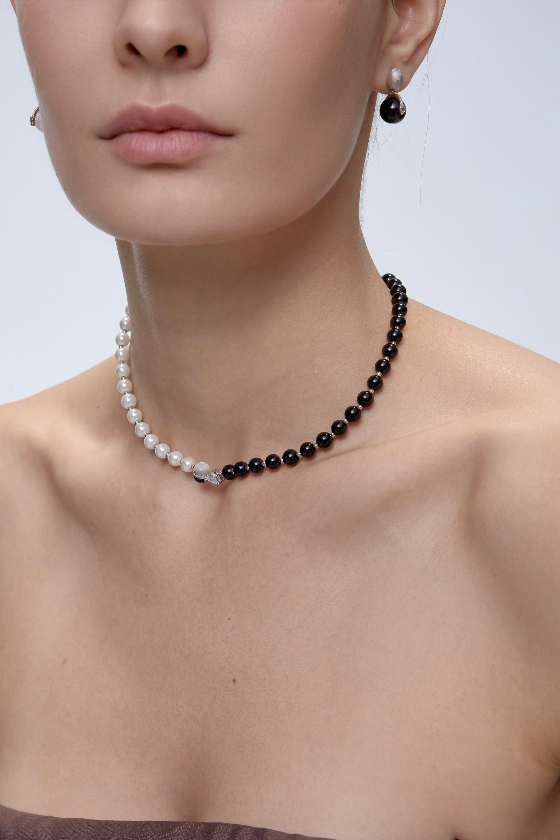 Ouroboros Choker worn on model pearl side - FREQNC