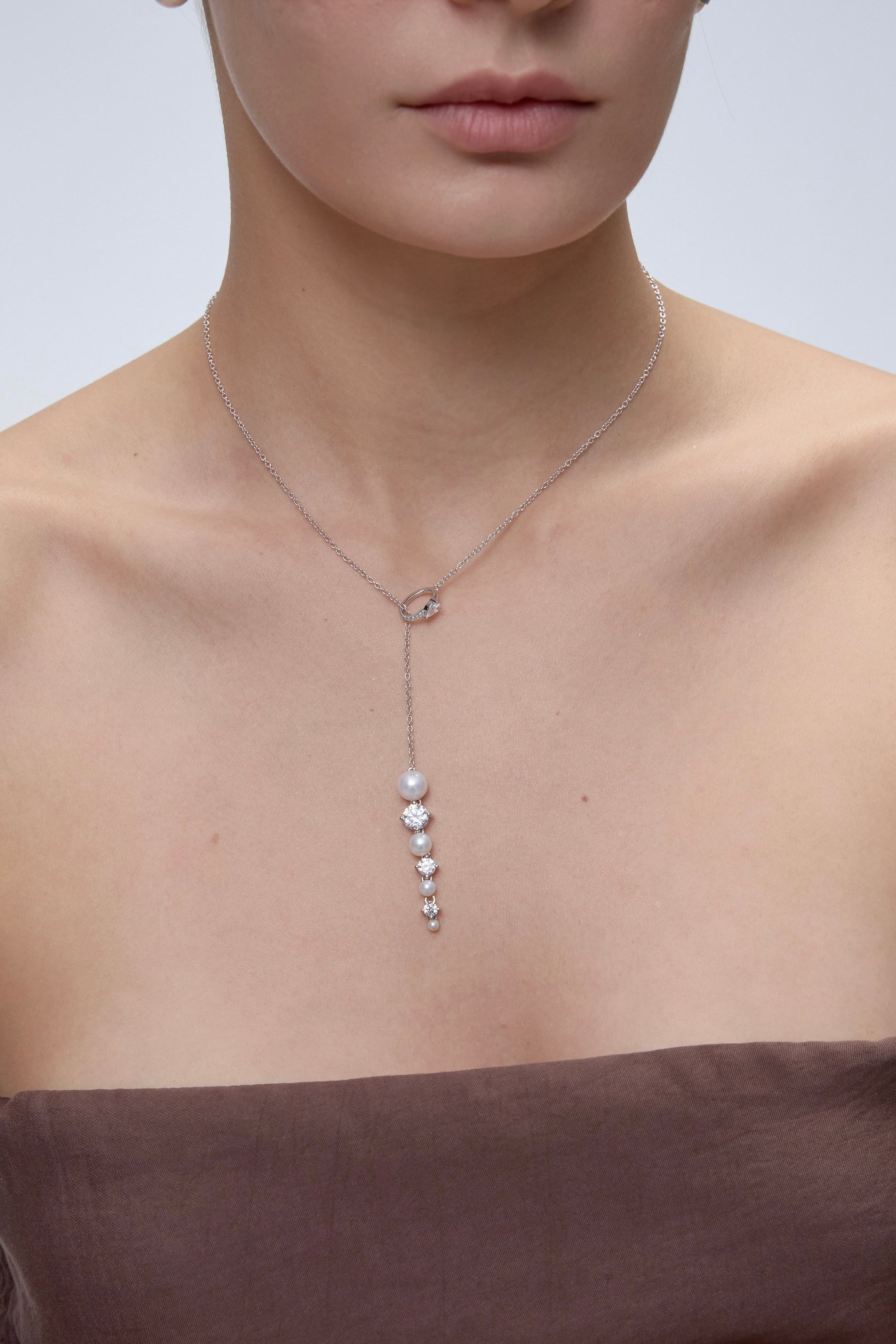 Ouroboros Pearl Drop Necklace worn on model - FREQNC