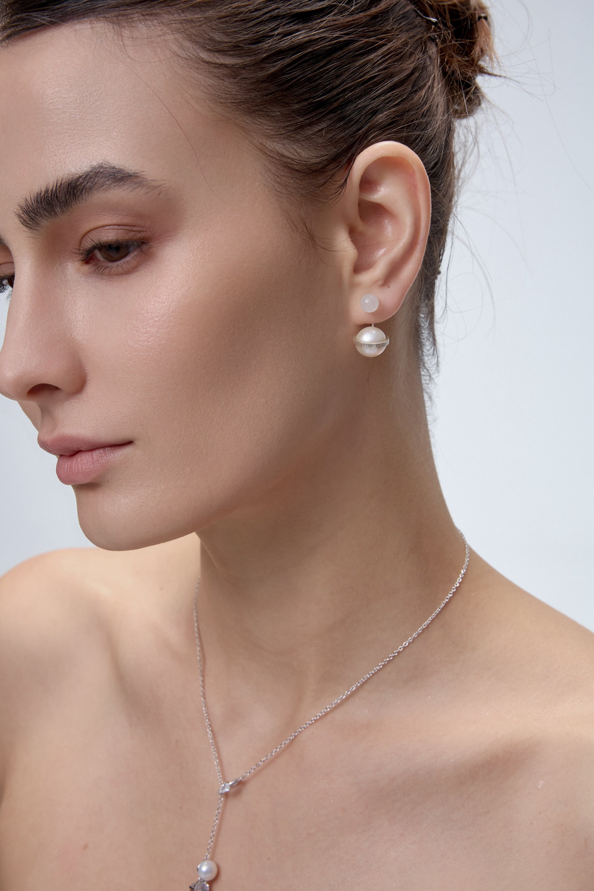 Orphic Cosmic Egg Earrings ear jacket detail on model - FREQNC
