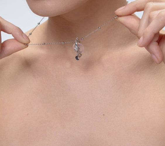 Ouroboros Charm with interchangeable donut crystal close-up - FREQNC