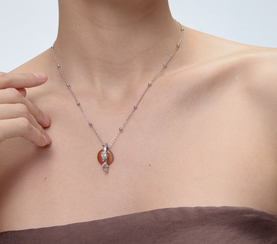 Ouroboros Charm pendant with clear quartz crystal detail - FREQNC