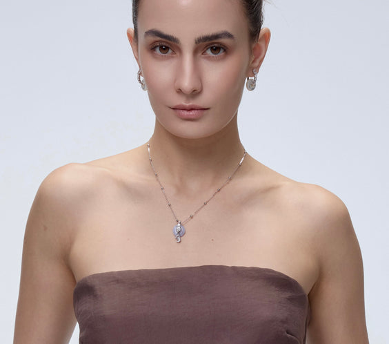 Ouroboros Charm pendant styling with chakra crystal - FREQNC atelier