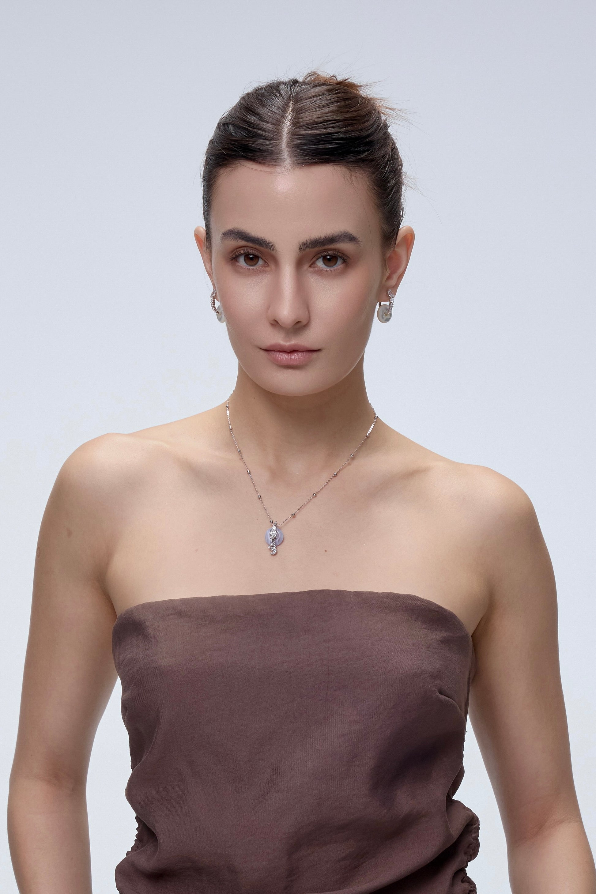 Ouroboros Charm pendant styling with chakra crystal - FREQNC atelier