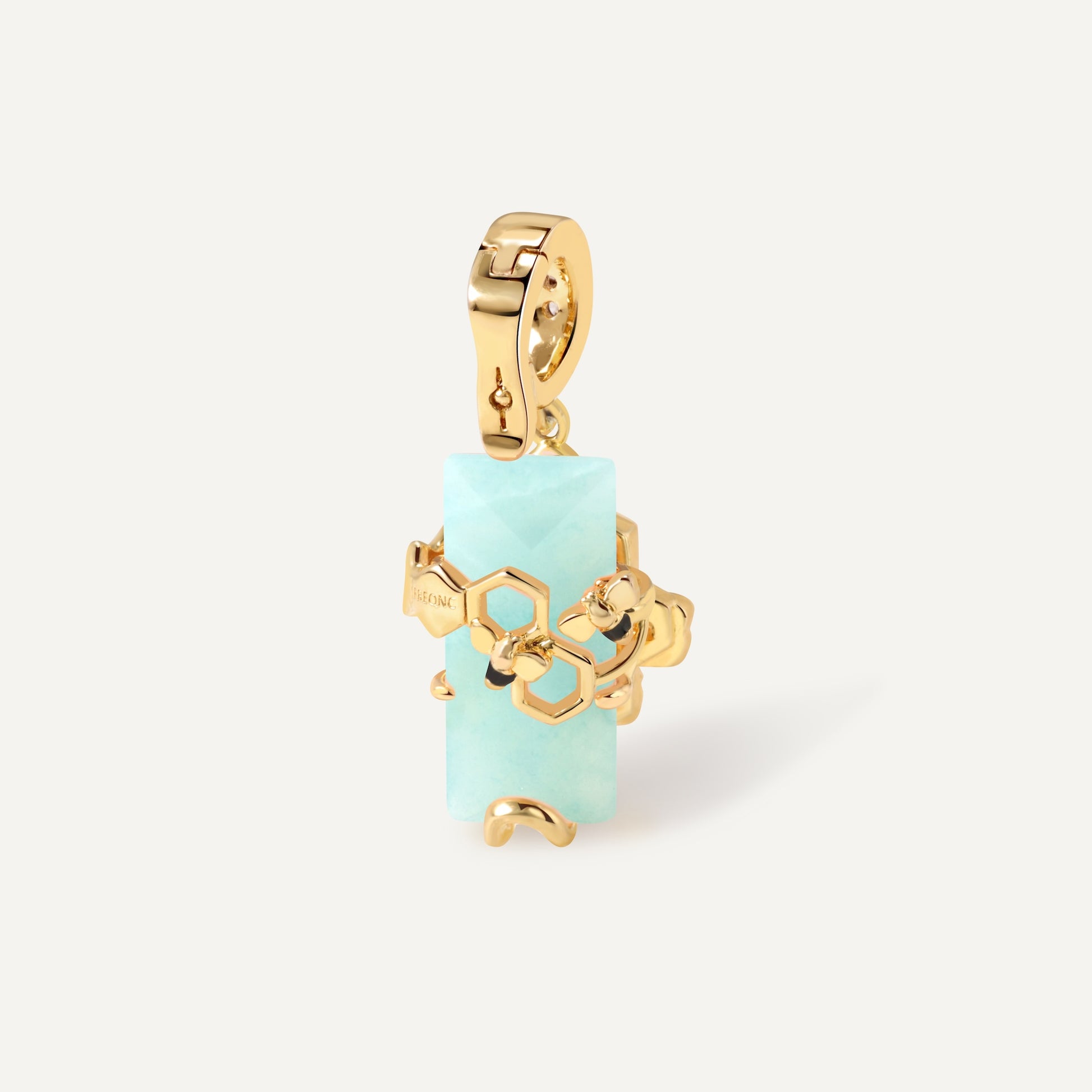 HexaMyst Bee Charm pendant with malachite crystal close-up - FREQNC atelier