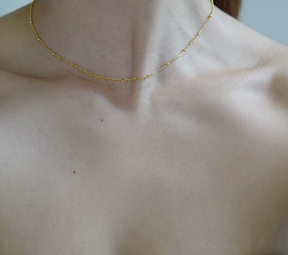 Rhea Gold Dot Necklace product detail close-up - FREQNC