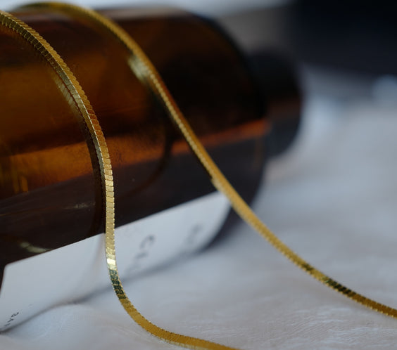 Argento Snake Chain layered with other necklaces on model - FREQNC atelier