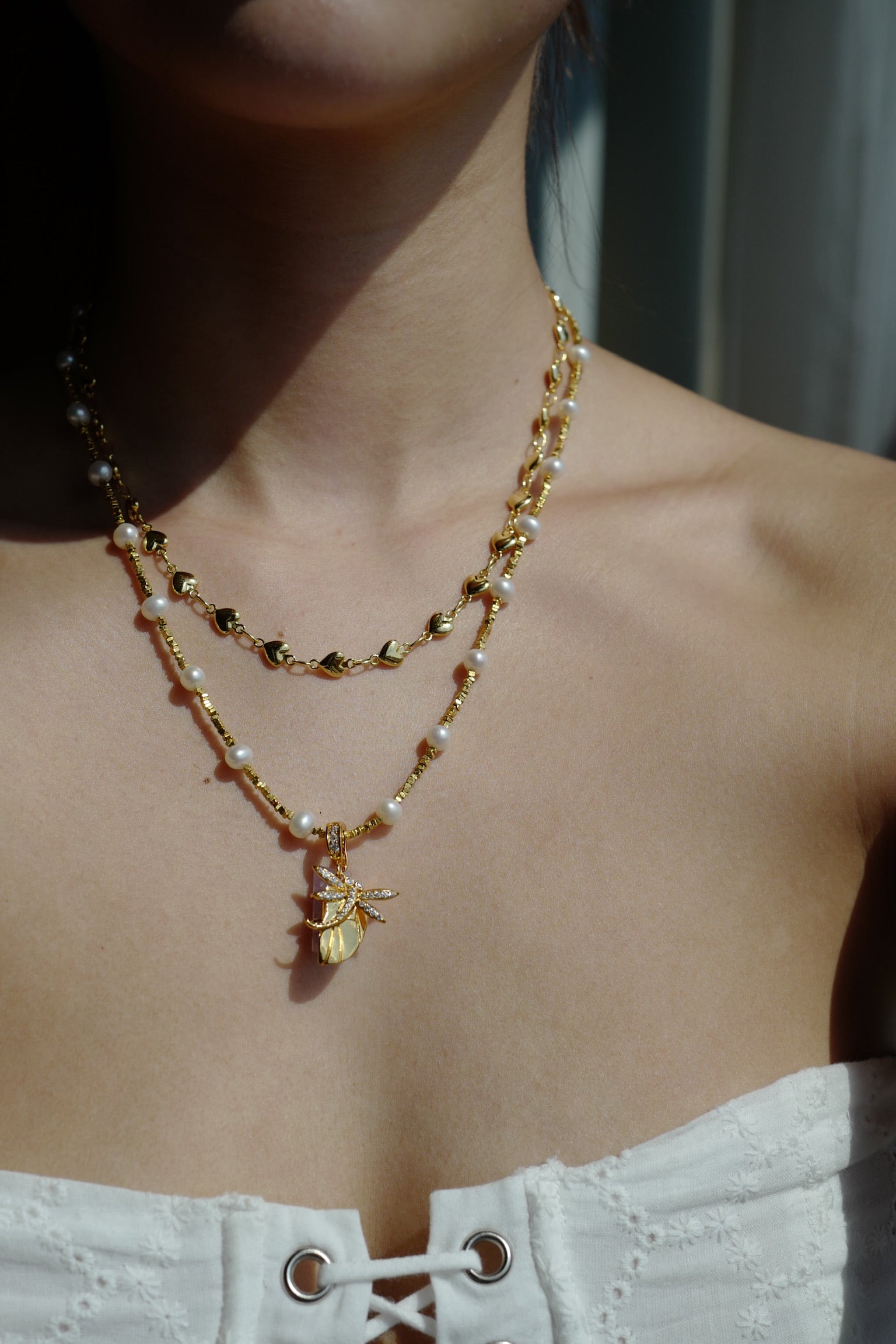 Amor Heart Necklace worn on model collarbone styling - FREQNC