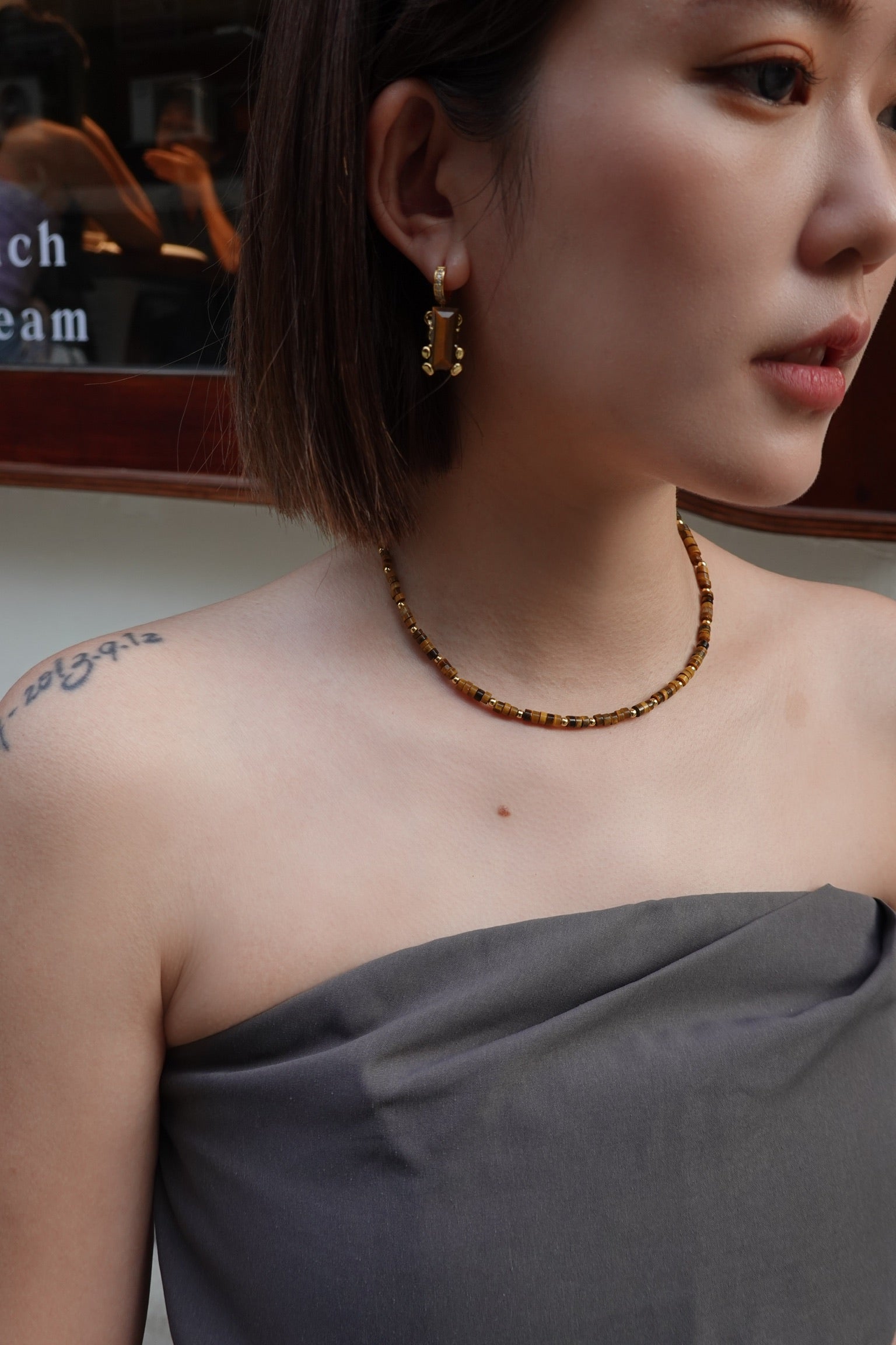 Cassie Tiger's Eye Necklace layered with other necklaces - FREQNC atelier