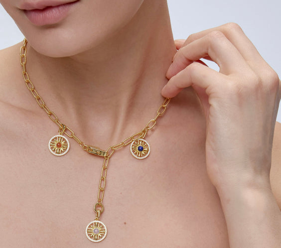 Sun Charm worn on model with layered necklace styling - FREQNC