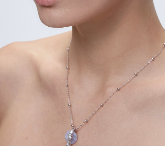 Rhea Beaded Necklace layered on model with pendant - FREQNC