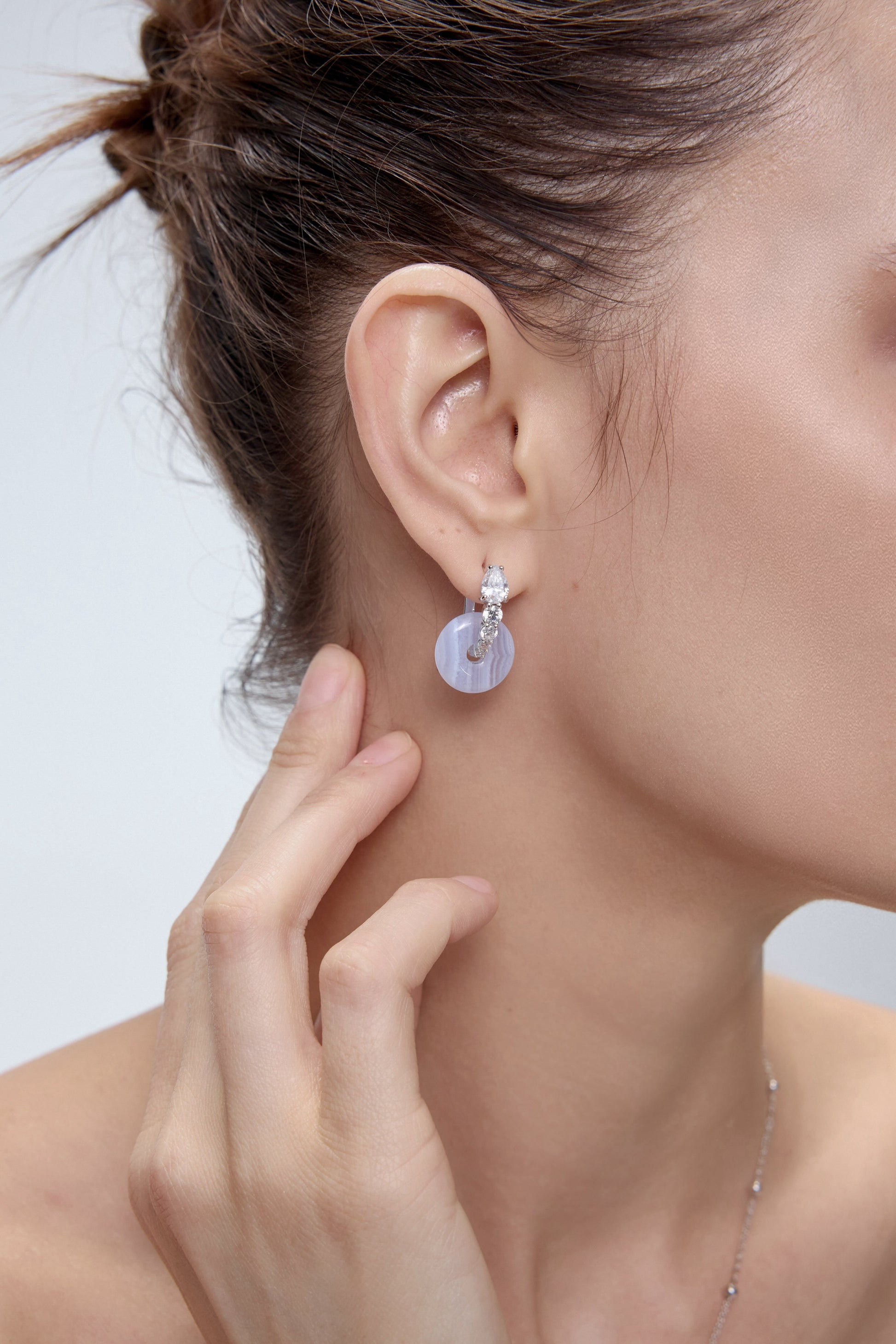 Ouroboros Earrings worn on model - FREQNC