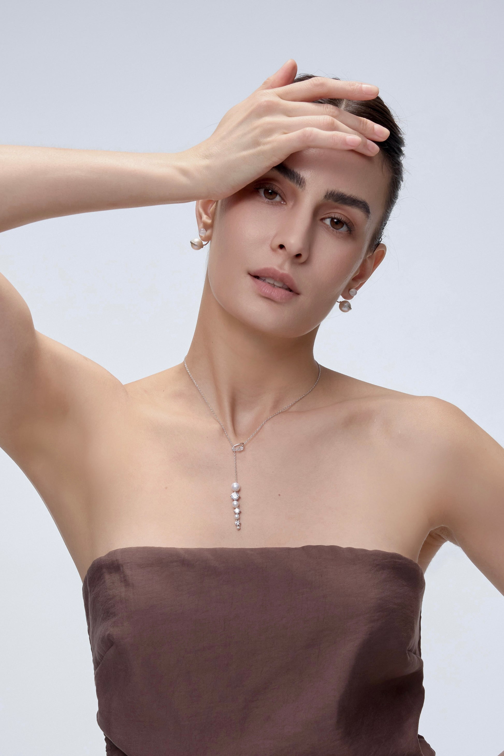 Ouroboros Pearl Drop Necklace on model close-up - FREQNC atelier