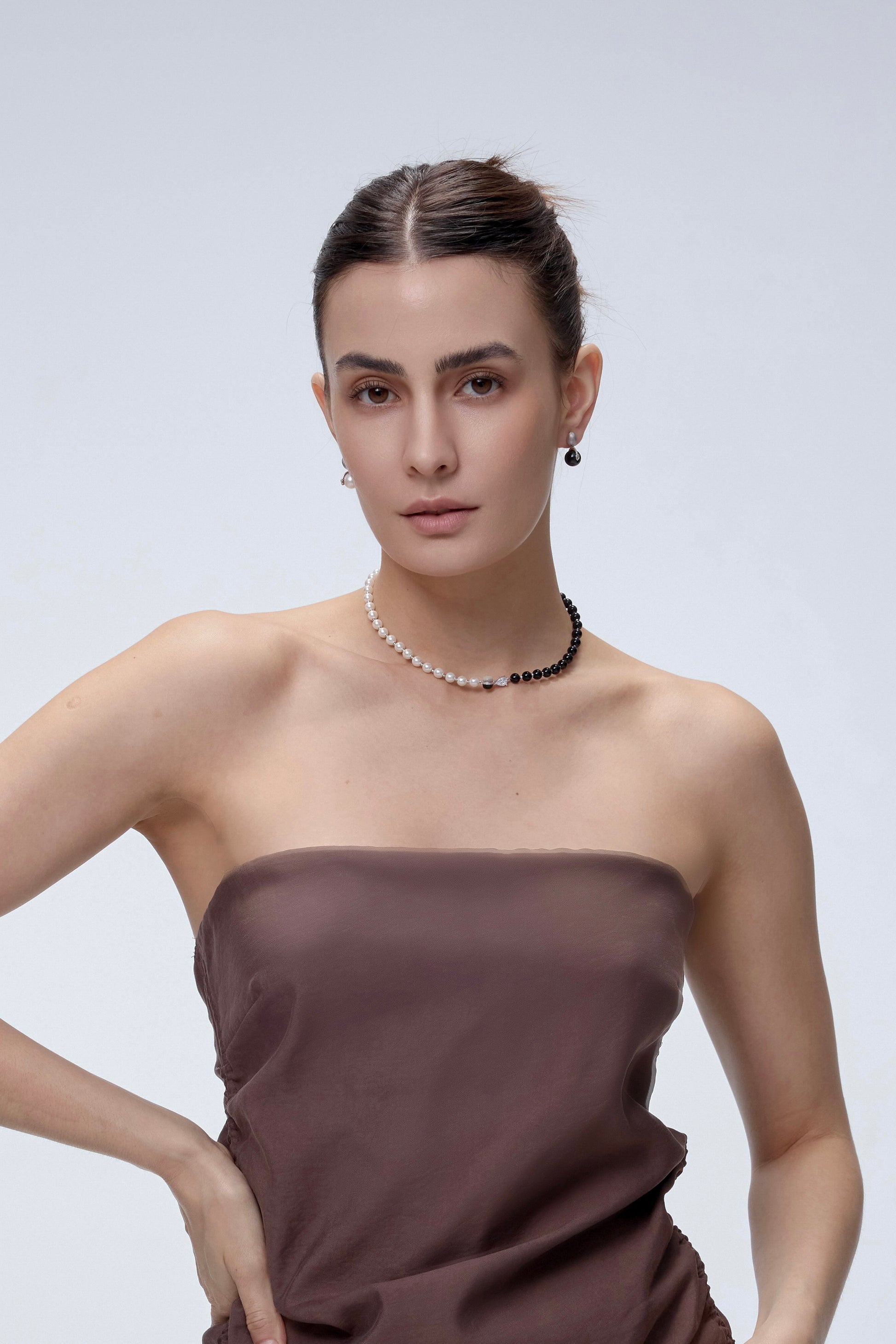 Orphic Egg Earrings on model with movement detail - FREQNC