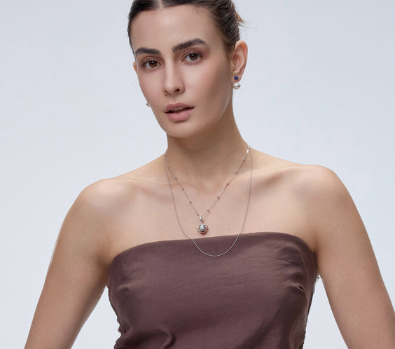 Orphic Egg Charm worn on model close-up - FREQNC spirit animal