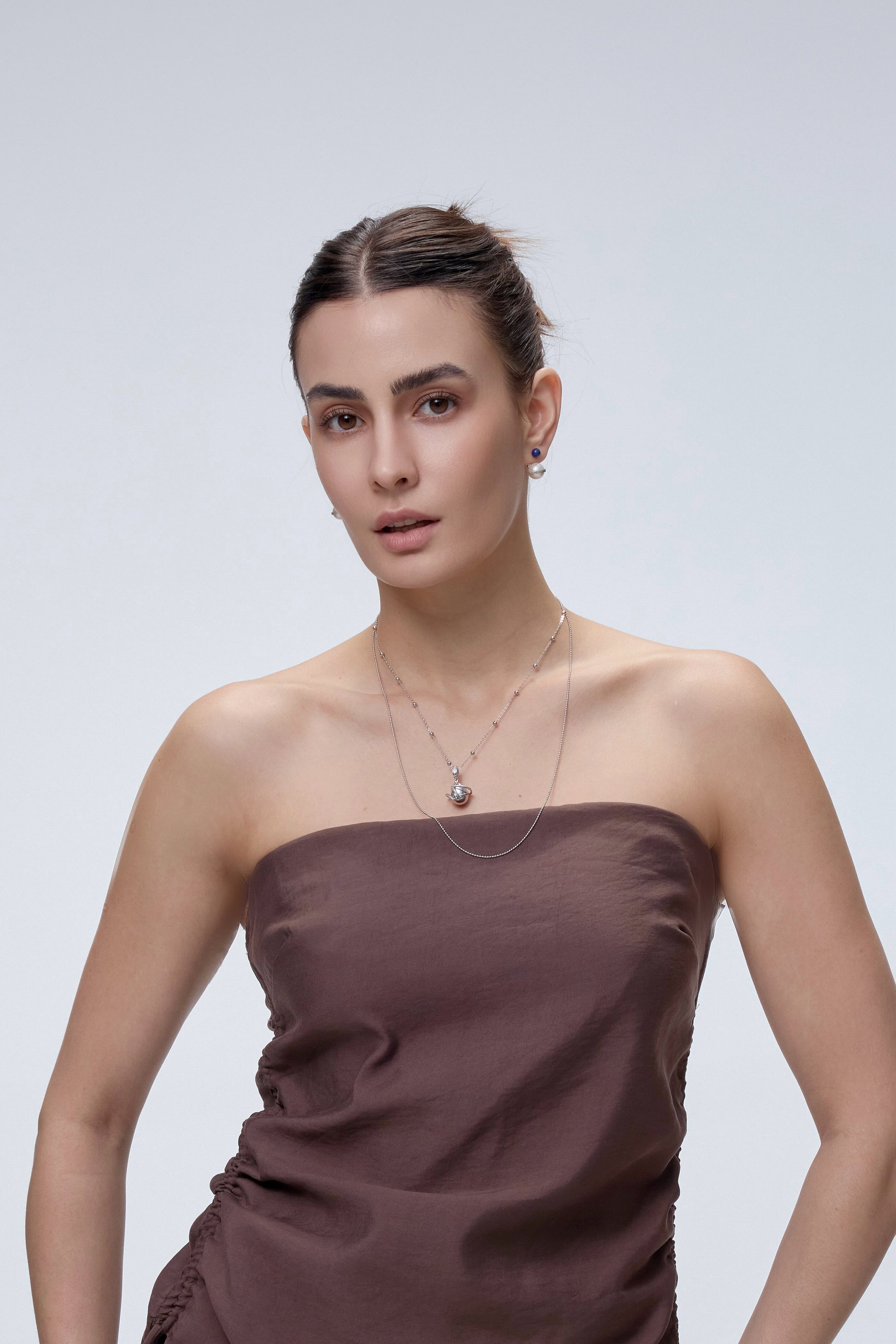 Orphic Egg Charm worn on model close-up - FREQNC spirit animal