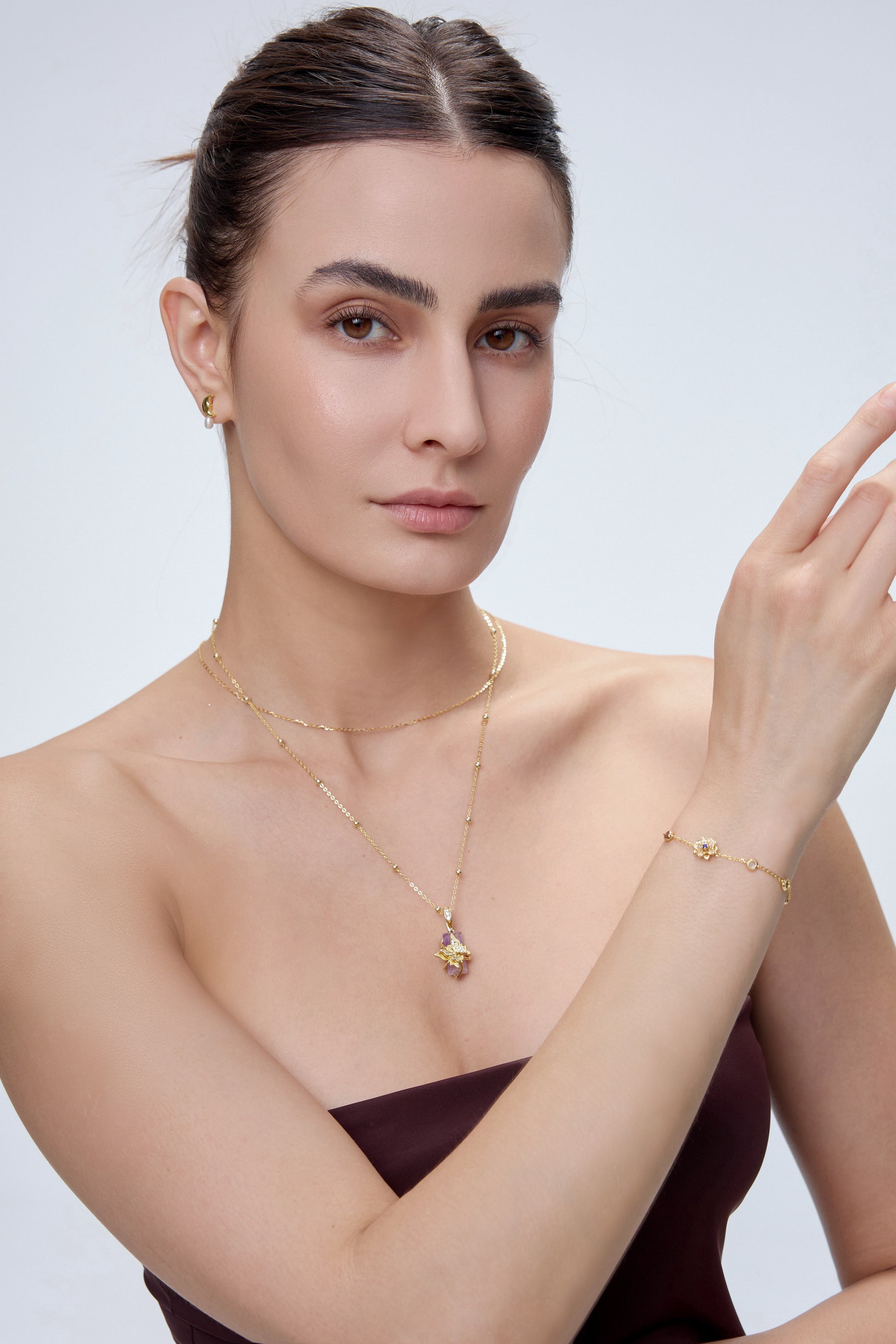 Twin Butterfly Charm pendant with lavender amethyst styled with gold layered necklace and bracelet - FREQNC spirit animal collection