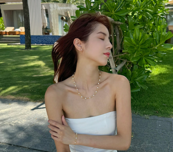 Cassie Natural Pearl Bracelet worn on model wrist - FREQNC