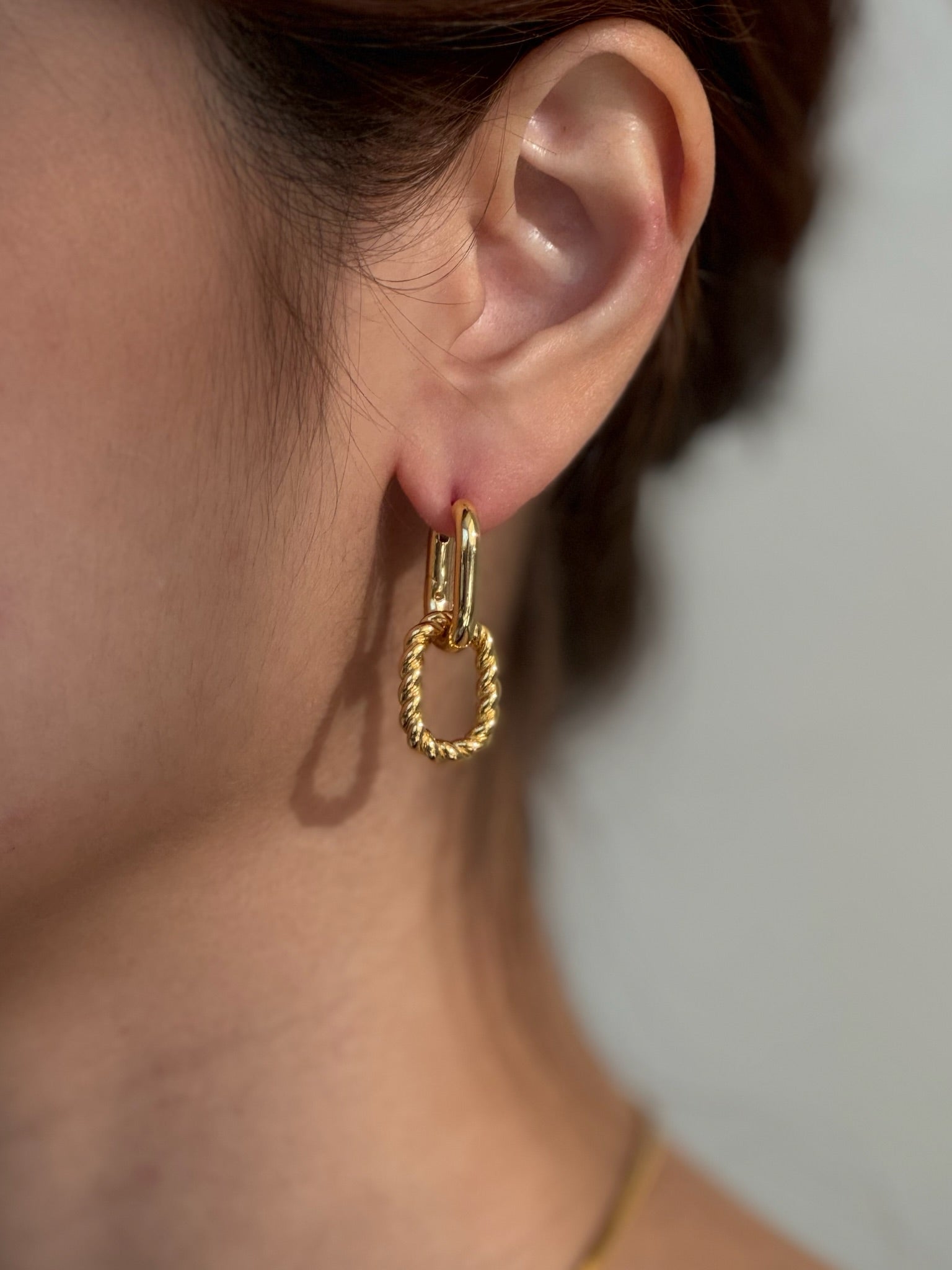 Baddie Convertible Twist Earrings worn on model - FREQNC