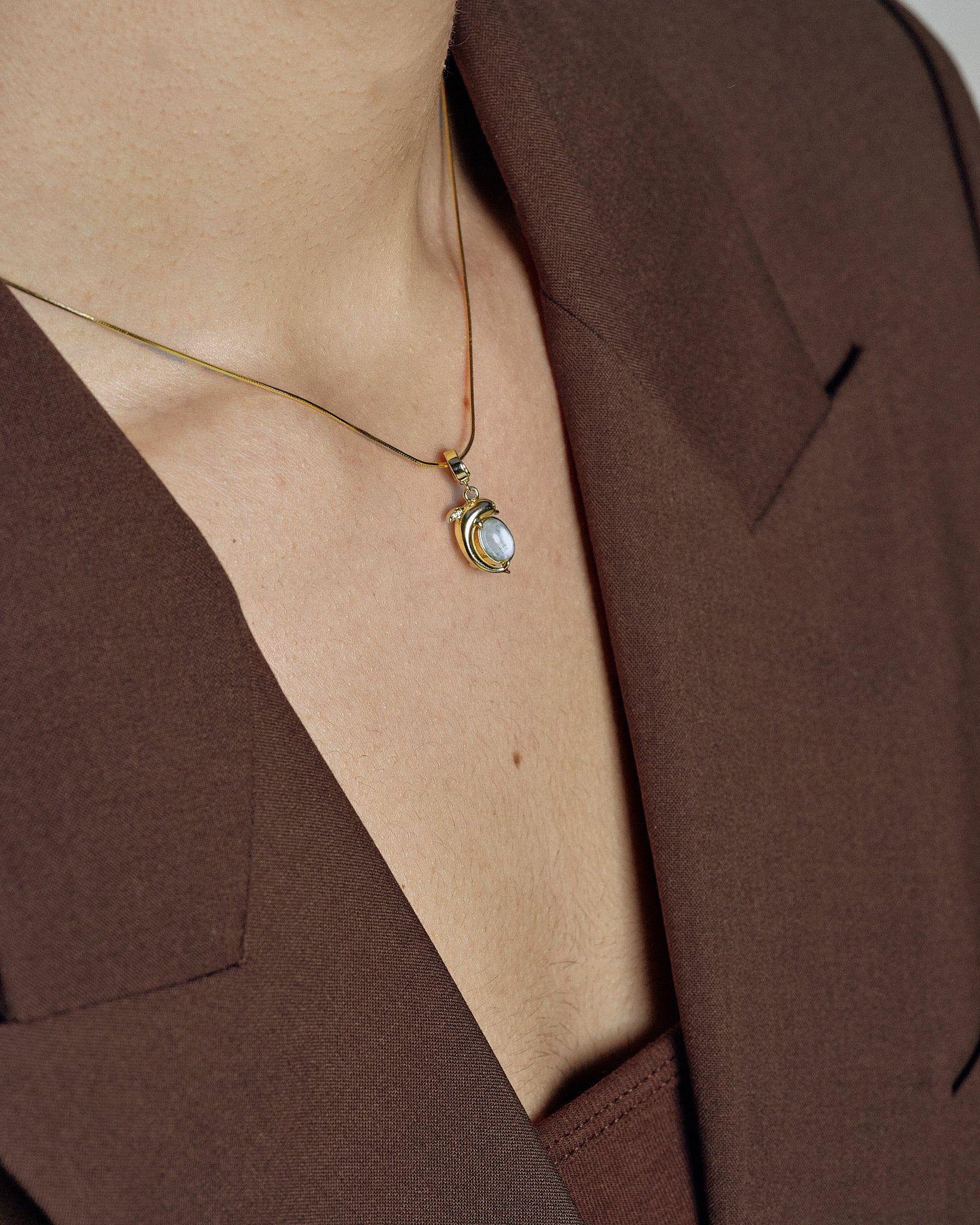Mini Dolphin Charm pendant on model layered styling - FREQNC