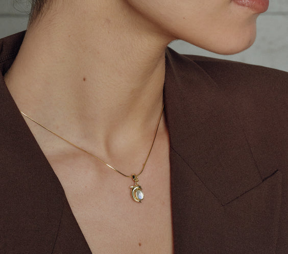 Mini Dolphin Charm worn on model with necklace - FREQNC