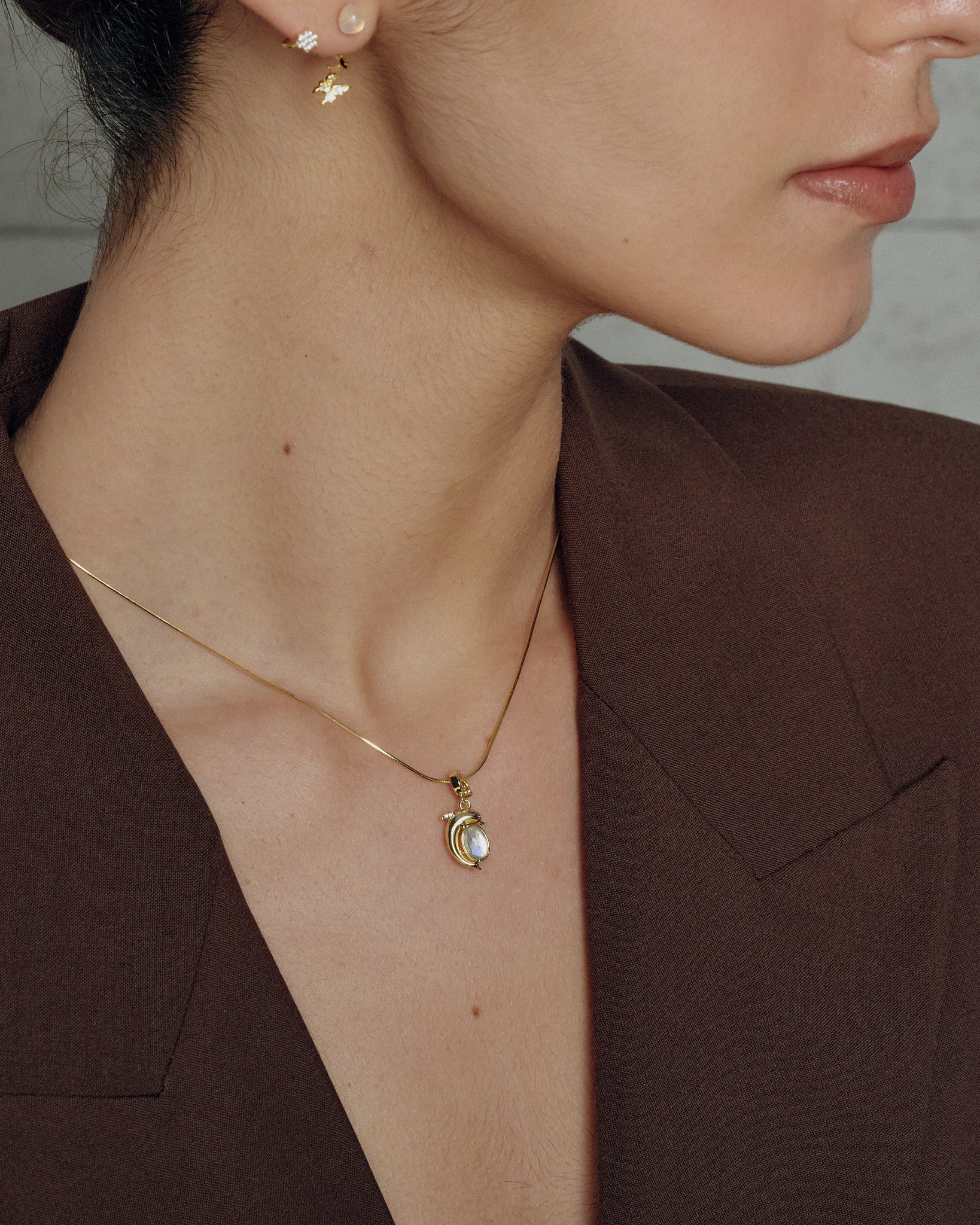 Mini Dolphin Charm worn on model with necklace - FREQNC