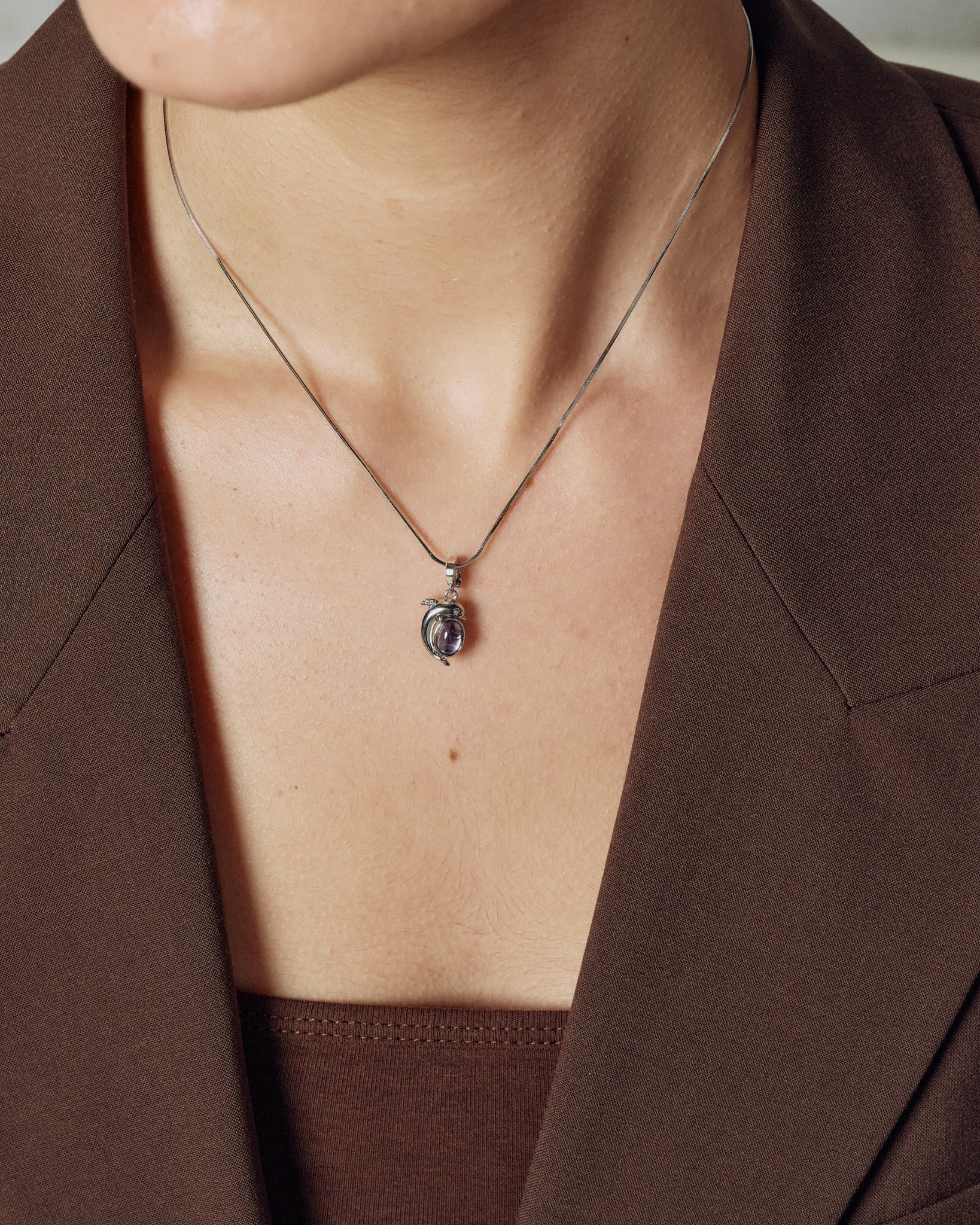 Mini Dolphin Charm styling on model close-up - FREQNC atelier