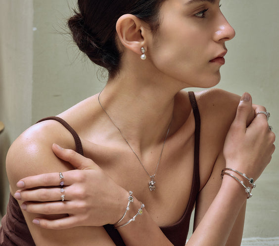 Mini Elephant Charm on model with chain necklace - FREQNC