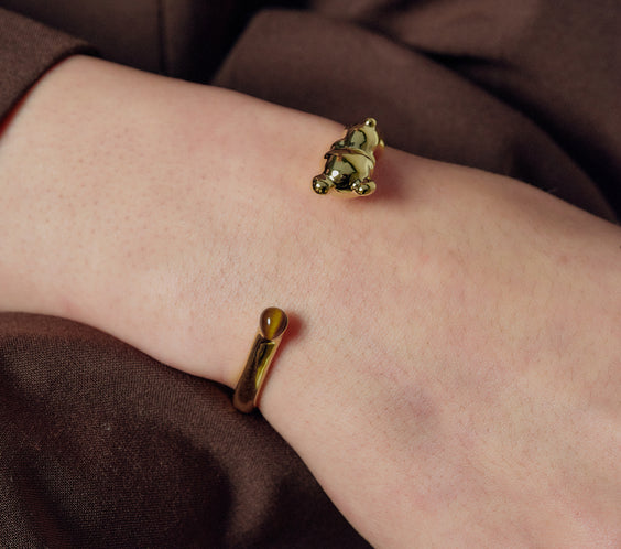 Cuddly Bear Bangle worn on model wrist close-up - FREQNC spirit animal