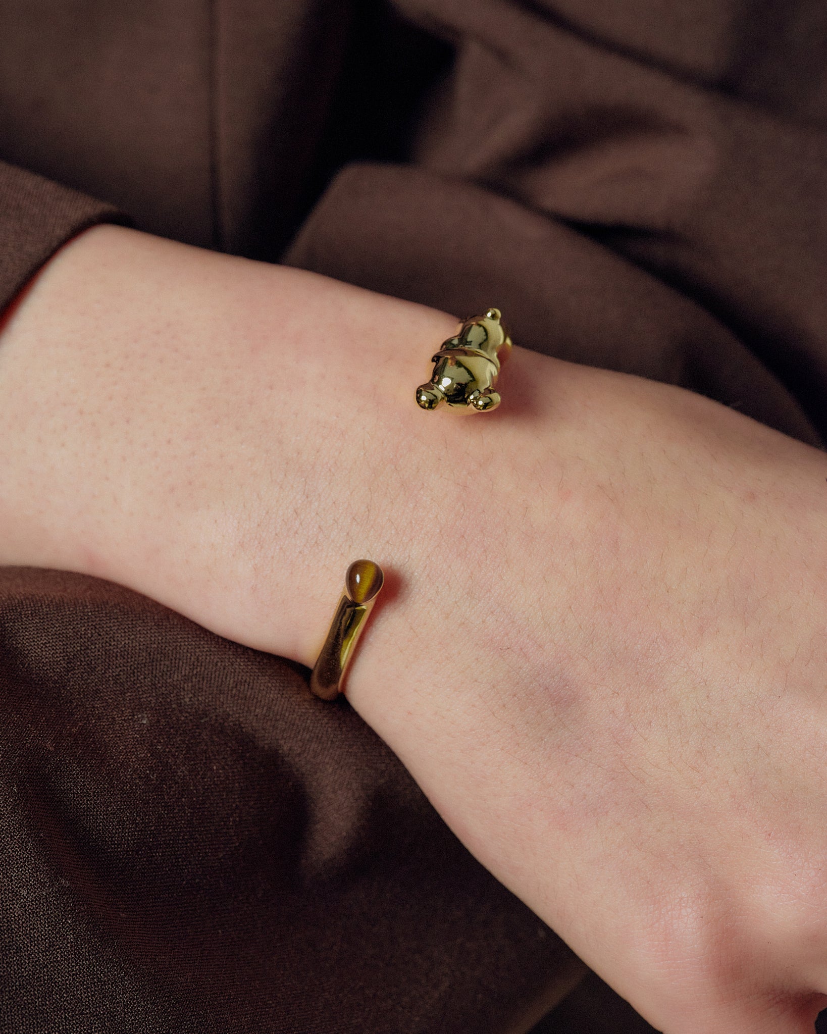 Cuddly Bear Bangle worn on model wrist close-up - FREQNC spirit animal