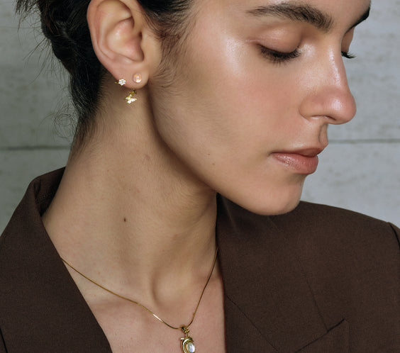 Butterfly Earrings worn on model with layered jewelry - FREQNC