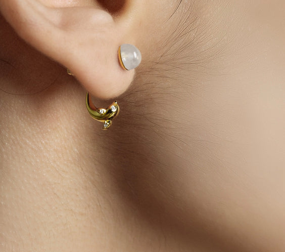 Dolphin Earrings worn on model with layered jewelry - FREQNC