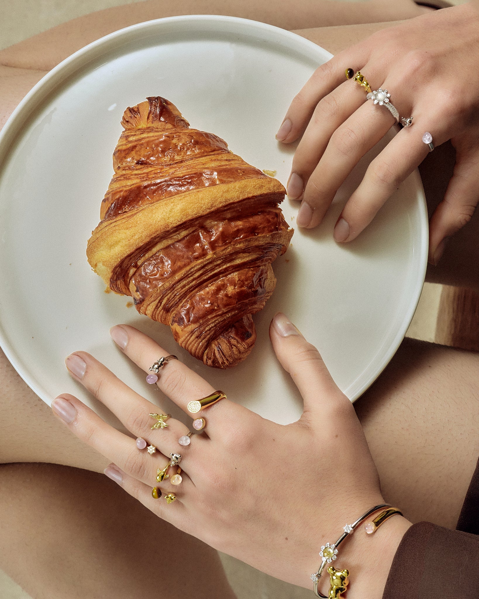 model wearing dolphin ring gold for the breakfast scence FREQNC atelier