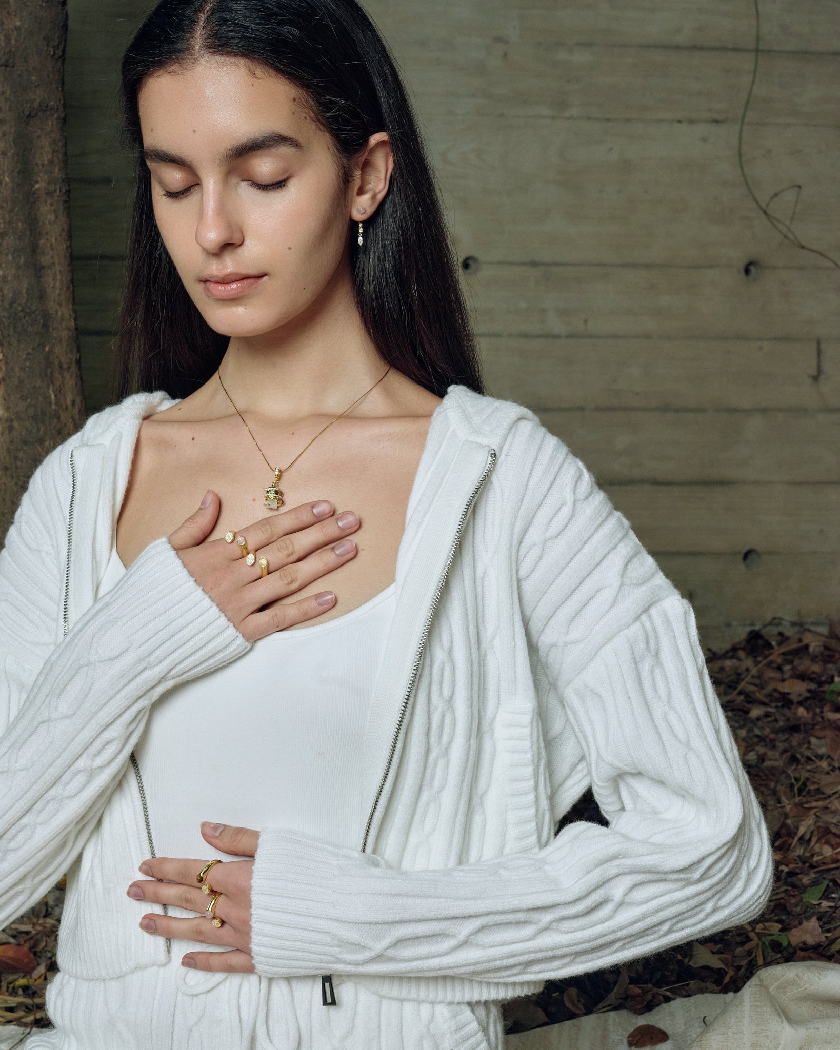 model wearing serpent ring gold while meditation FREQNC atelier